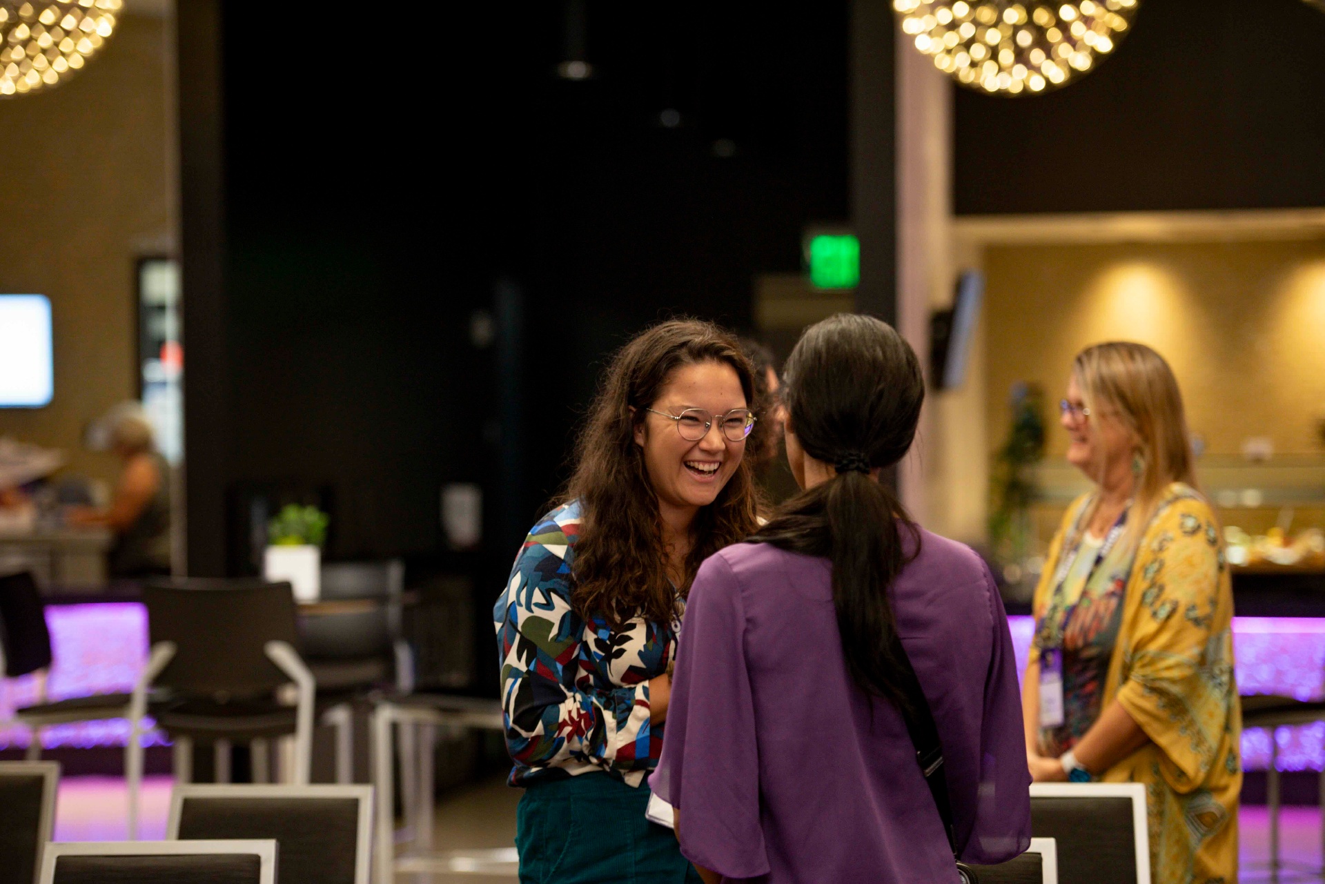 Women laughing together at a Ladies Playbook event